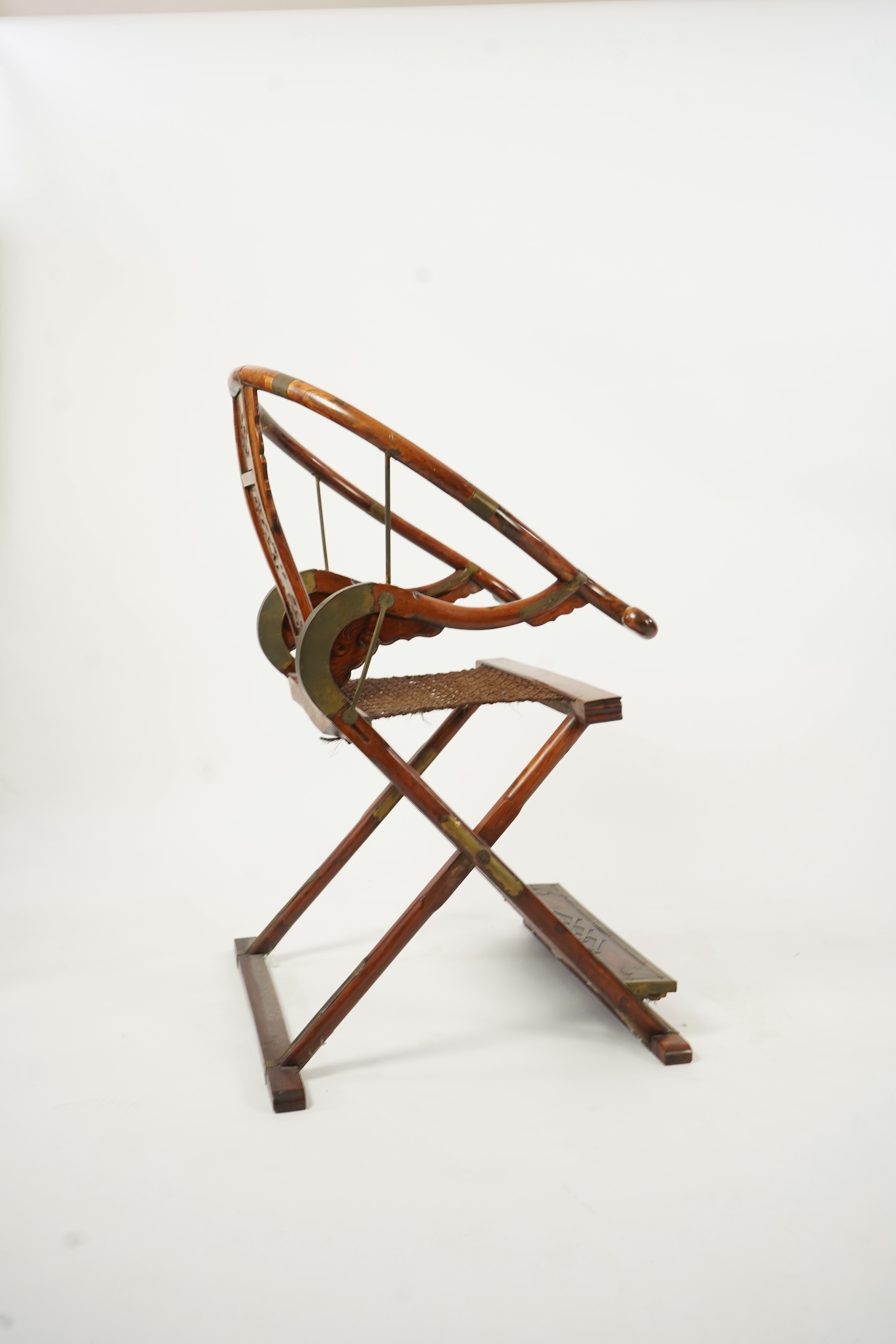 A Chinese huanghuali, hongmu and brass mounted folding hunting chair, jiaoyi, early 20th century
